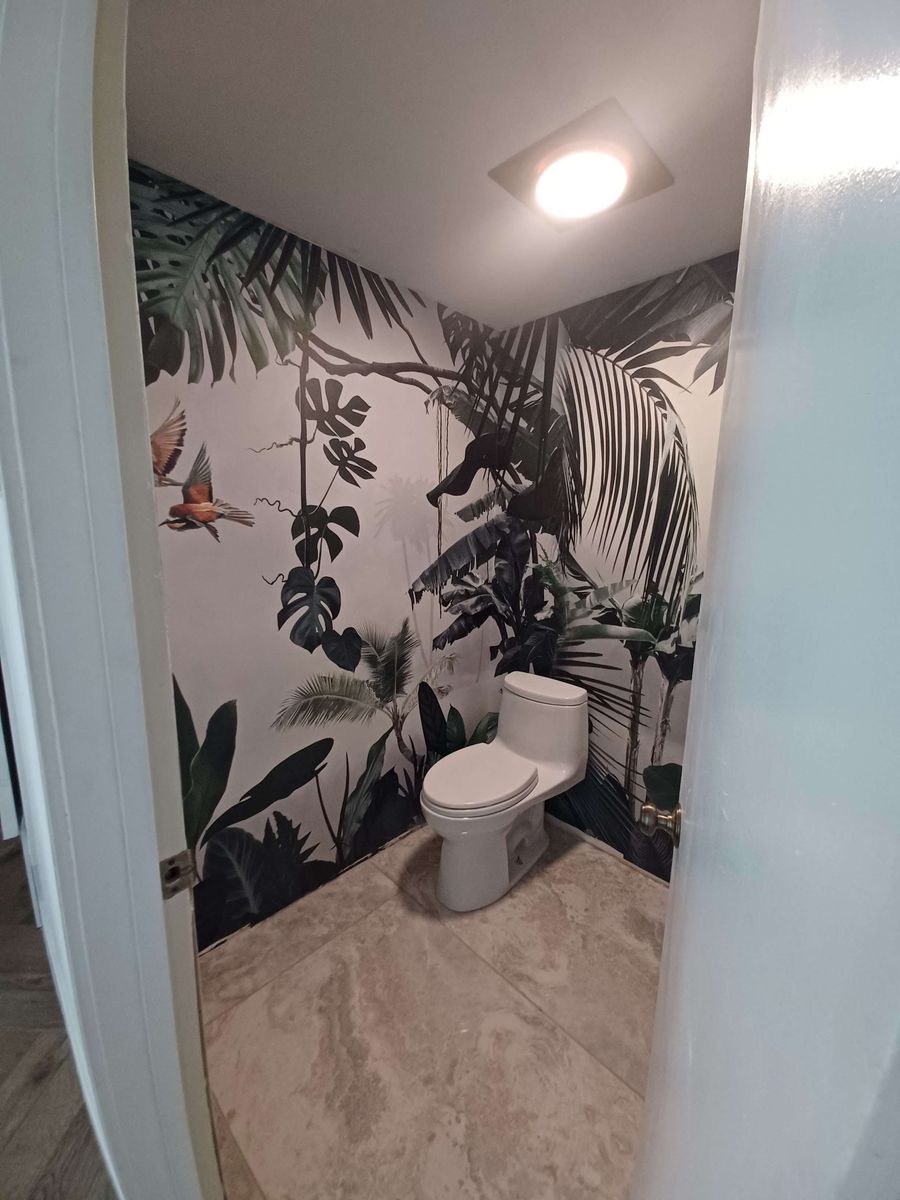 Powder room with a monochrome tropical mural of palms and birds